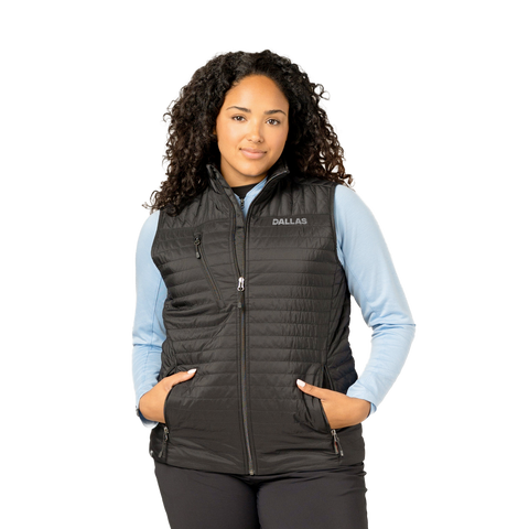 Woman wearing a black vest with 'Dallas' branding on a white background